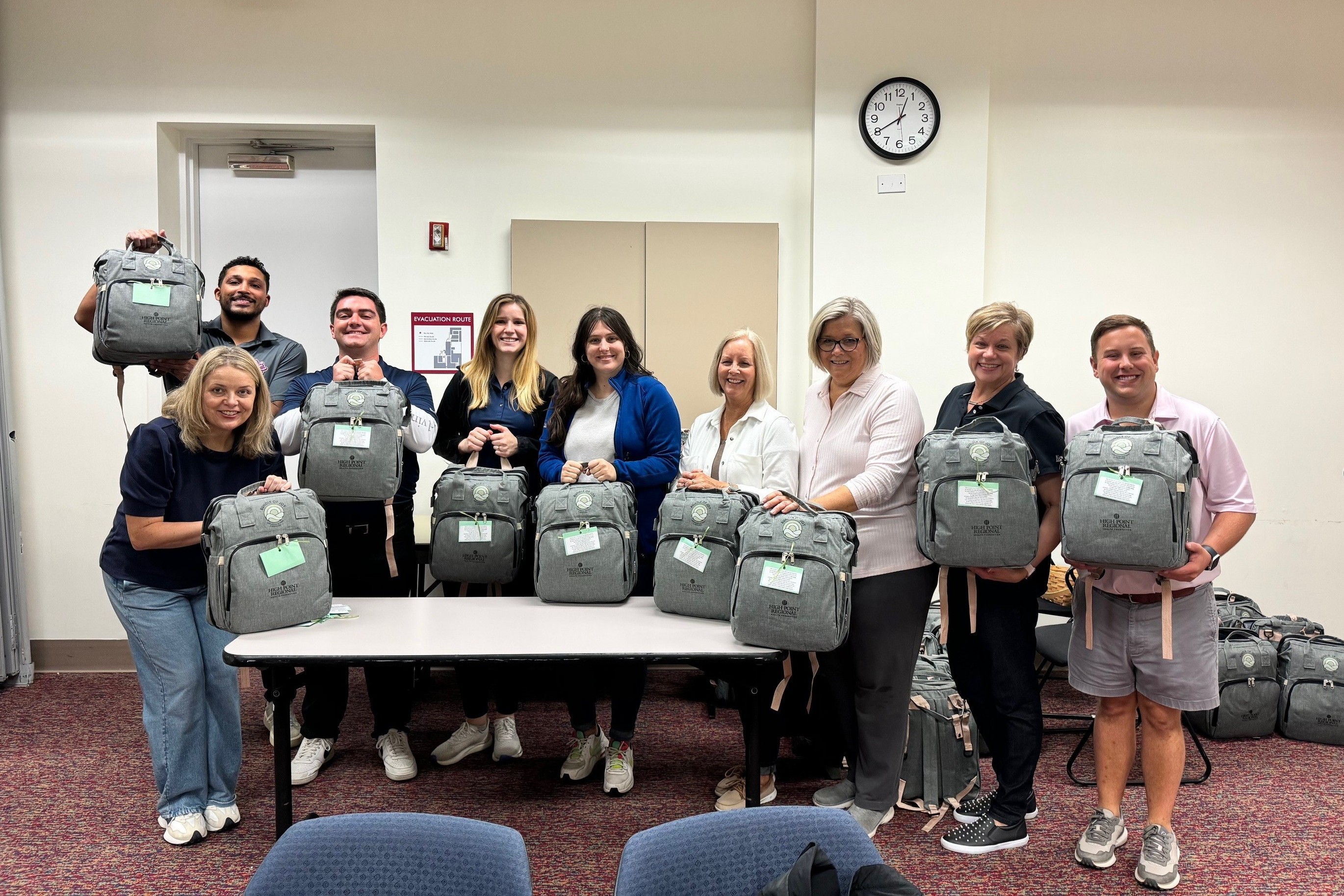 Key Risk associates assemble kits for expecting mothers