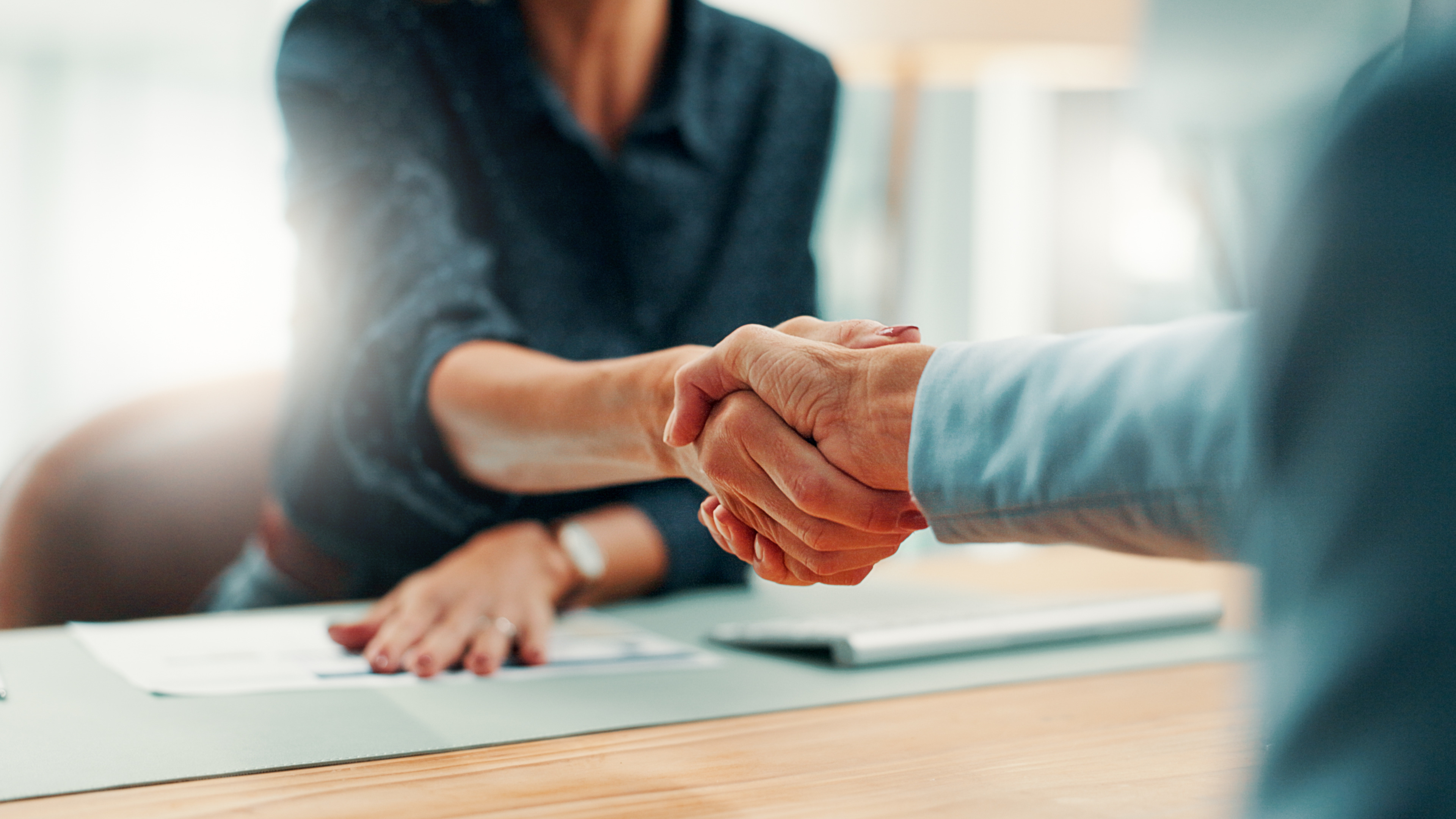Mastering PEO Workers Comp Professionals shaking hands